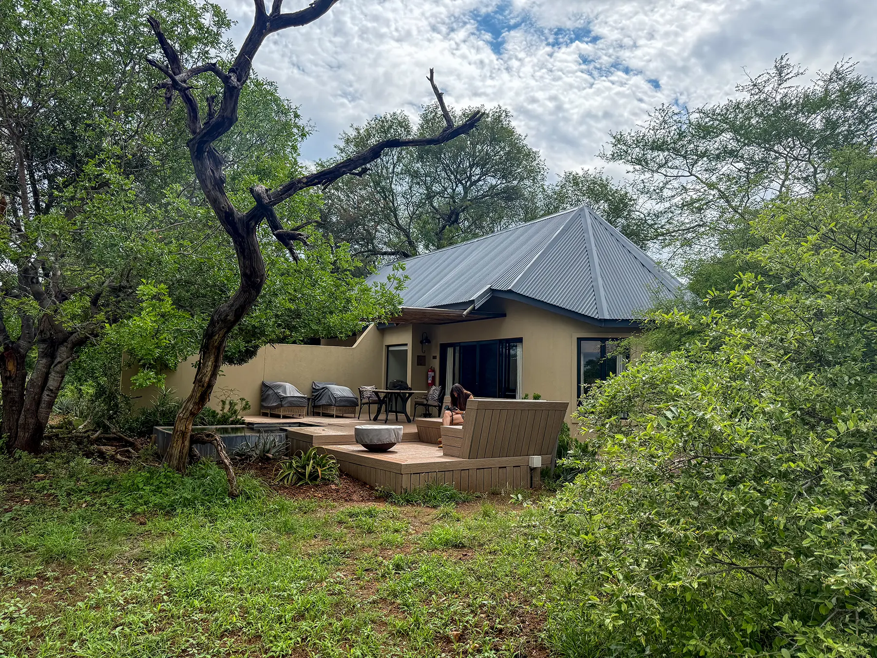 An exterior view of a safari suite with a private deck and plunge pool surrounded by green bushveld on safari in Timbavati Private Nature Reserve, South Africa