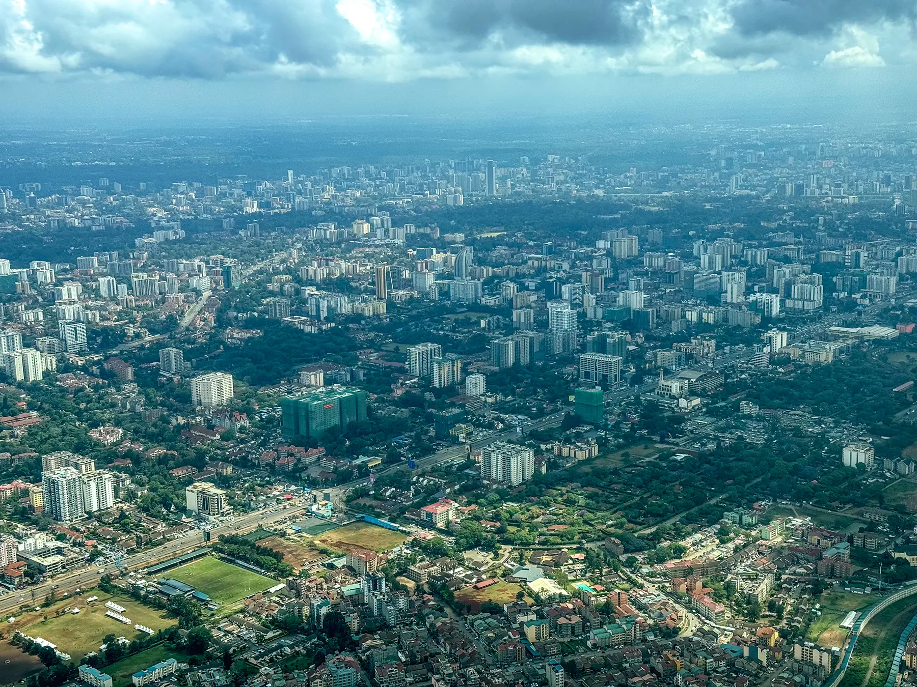 Wide aerial view of Nairobi city spreading to the horizon from a charter plane in Kenya