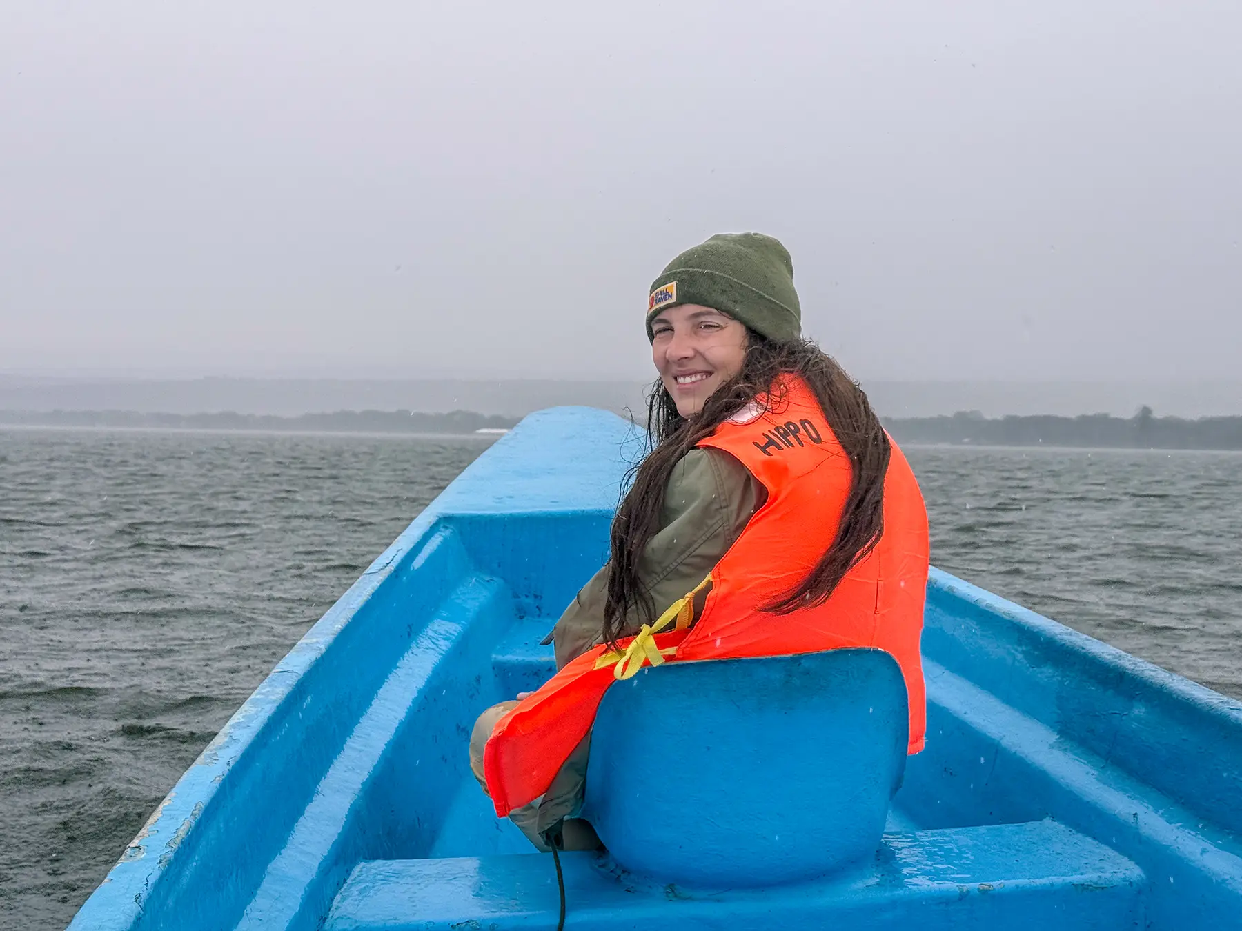 Ella McKendrick smiling on a boat on Lake Naivasha, Kenya