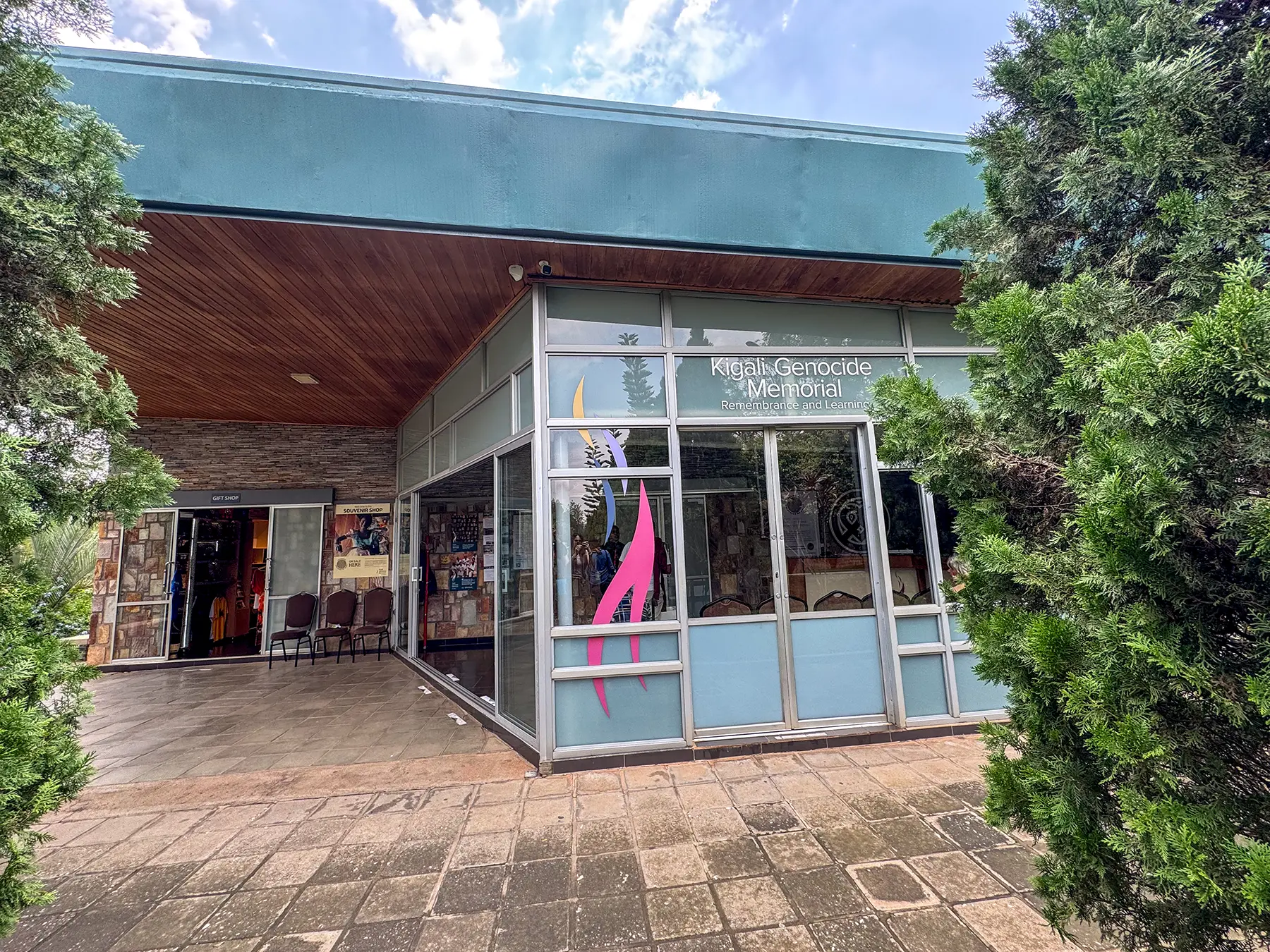Entrance building with signage and glass frontage at Kigali Genocide Memorial in Kigali, Rwanda