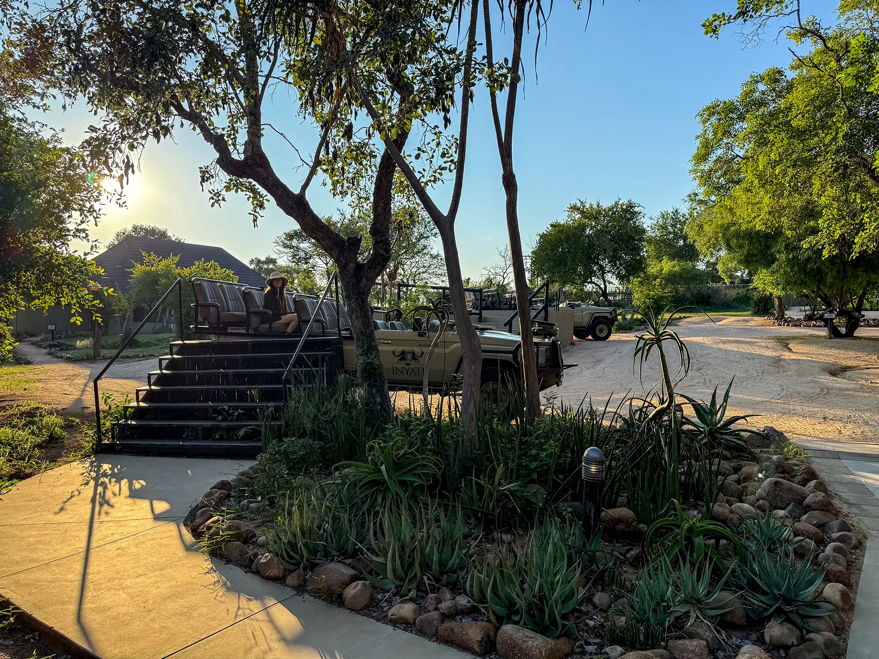 Ella McKendrick seated in a Land Cruiser by the boarding steps at Inyati Game Lodge in Sabi Sand Game Reserve, South Africa