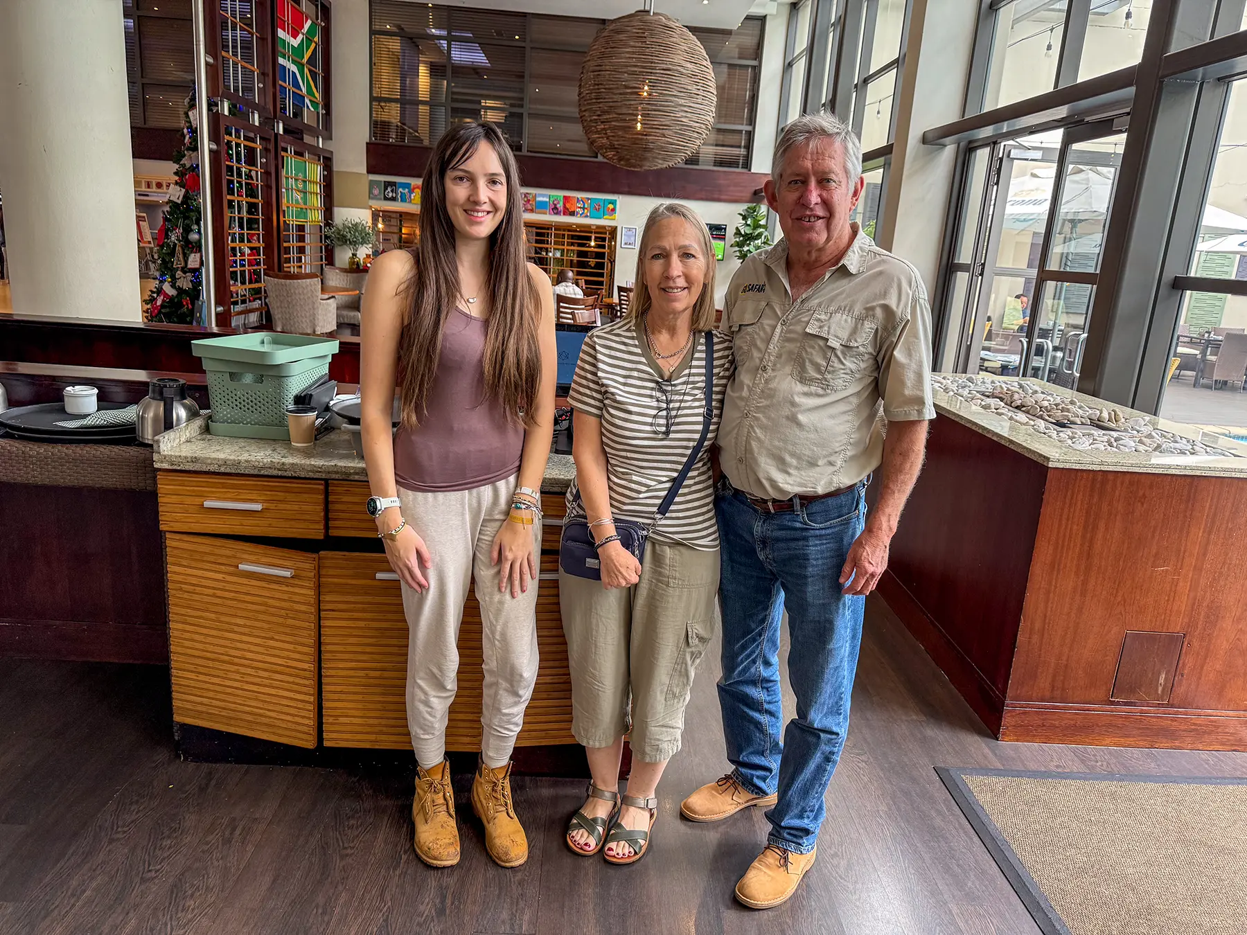 Ella McKendrick with two local tour operators at a tour operator reception in South Africa